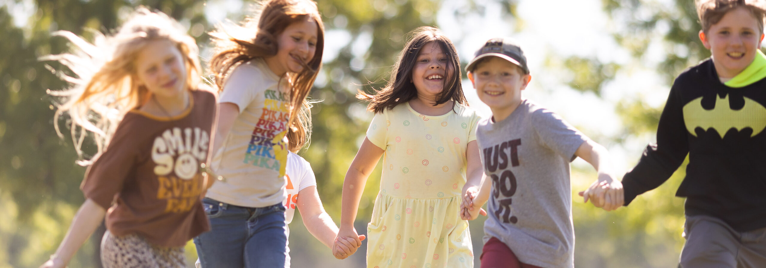 CHS students holding hands and running and playing